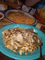 Gio's Special Beef Chicken'Shrimp on Bed of Rice Cheese Sauce Drizzled Ontop